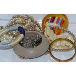 Bag of various costume jewellery including bone tablet bracelet