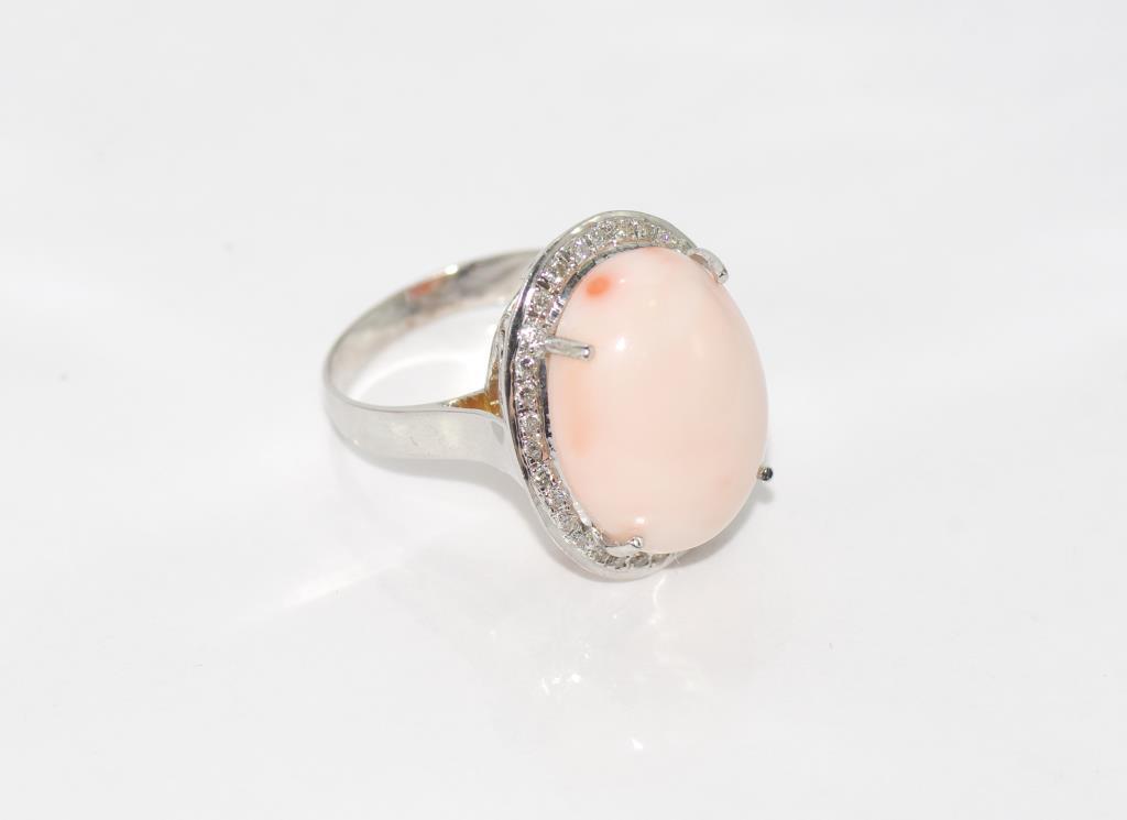 18ct white gold, pink coral and diamond ring weight: approx 6.93 grams, size: P-Q.8