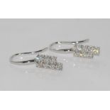 18ct white gold earrings, shaped left & right 14 diamonds = 1.00cts, H/ Si 1, weight: approx 3.0