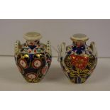 Pair of antique Derby miniature vases in the Imari palette, red painted mark circa 1820