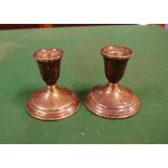 Pair of sterling silver candle holders 8cm high approx.