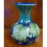 William Moorcroft "Leaf and Berries" baluster vase blue signature and impressed mark to base,