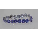 18ct white gold tanzanite and diamond bracelet tanzanite =33.92ct, diamonds = 0.89ct, weight: approx