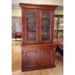 Edwardian mahogany elevated bookcase with 2 glazed doors above a drawer and 2 timber panel doors,