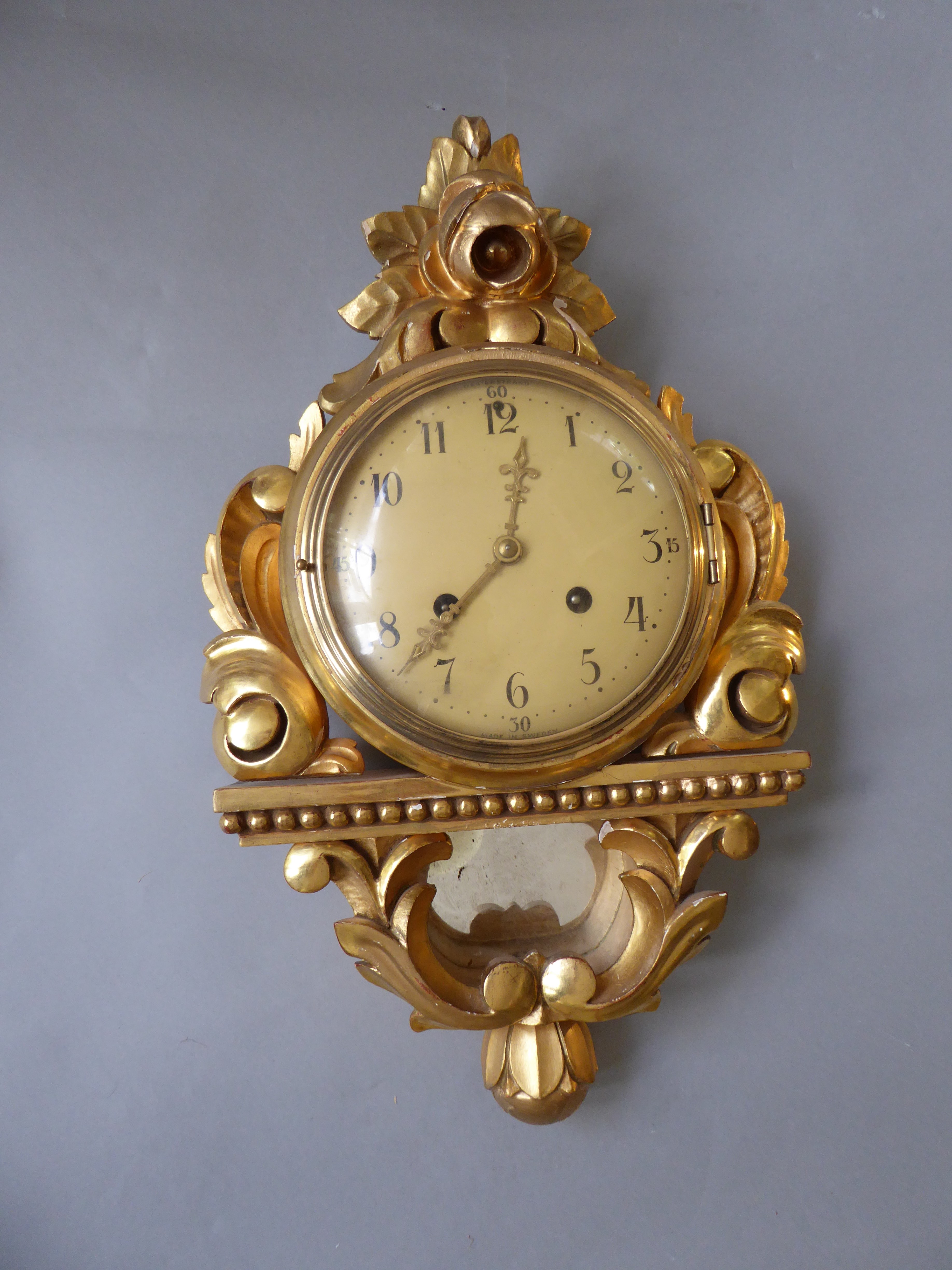 A Swedish gilt decorated cartel clock by Westerstrand, H 53cm W 37cm D 14.5cm