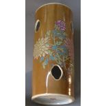 A Chinese famille rose vase with peoni and chrysanthimum and pierced decoration with Kanxi mark to