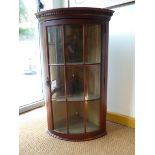 A Mahogany bow-fronted astragal glazed corner cupboard with dental moulded freeze H103 cm W61.5cm