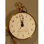 A C19th 18 ct gold fob watch with enamel dial and engraved floral surround and shell back D5.5cm (