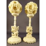 A pair of C19th Chinese ivory puzzle balls D5.5cm each, on stands H11cm D5.5cm