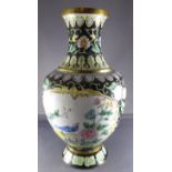 An enamel vase decorated in the Chinese style with panels of birds and peonies. AFÂ  Â  H22.7cm