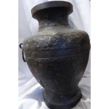 A C19th large Chinese Ming style bronze archaic bulbous water vessel with twin rings