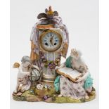 A Continental porcelain figural mantel clock: modelled with a seated barefoot girl with an open