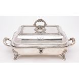 A plated warming dish and cover: crested, with gadrooned borders, reeded loop handle to the cover,