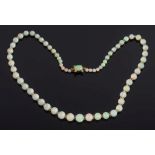 A graduated opal bead and faceted glass bead, single string necklace:, the opals graduating from 3.