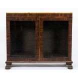 An early 19th Century rosewood low bookcase:, surmounted by a panel of variegated peach marble,