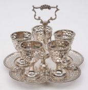 A Victorian silver five egg cups and stand, maker George Fox, London, 1865: crested,