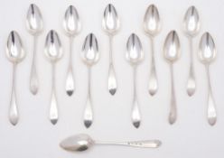 A set of twelve George III provincial Scottish pointed old English pattern silver dessert spoons,
