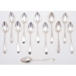 A set of twelve George III provincial Scottish pointed old English pattern silver dessert spoons,