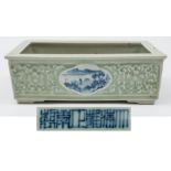 A Chinese porcelain celadon ground jardiniere: of shallow rectangular form with quadrilobed