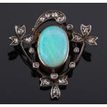 An opal and rose diamond brooch:, the single, oval opal approximately 15mm long x 11mm wide,