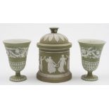 A Wedgwood sage jasper ware tobacco jar and cover and a pair of vases: the former decorated in