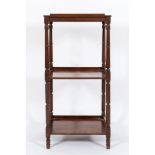 A Regency mahogany three-tier whatnot:, on turned uprights,