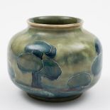 A Moorcroft pottery vase: of squat globular form tubelined in the Hazledene pattern blue,