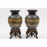 A pair of Doulton Lambeth lamp bases decorated by Hannah Barlow: of oviform with cast bronze base