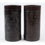 A pair of Chinese bamboo brush pots: of cylindrical form decorated with riverside landscape and