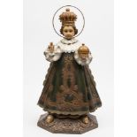 A large carved wood and polychrome decorated figure Child of Prague: with wire halo,