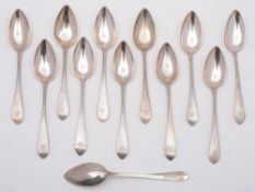 A set of twelve George III Scottish silver pointed Old English pattern dessert spoons,