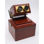 A mahogany and lacquered brass achromatic stereoscope by R and J Beck Cornhill London: with rack