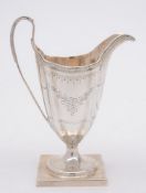 A Georgian silver pedestal cream jug, unmarked: initialled, of  helmet-shaped outline,