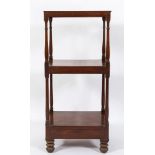 A Regency mahogany three-tier whatnot:, fitted with a drawer to the base, on bun feet,