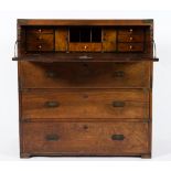 A 19th Century mahogany and brass bound secretaire military chest:, in two parts,