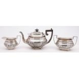 An Edward VII silver three-piece tea service, maker John & William Deakin, Sheffield,