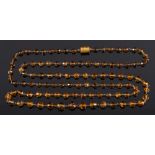 A long, faceted bead citrine single string necklace:, approximately 126cm long.