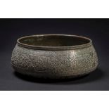 A Middle Eastern silver inlaid brass bowl: of squat form with everted rim,