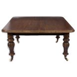 A Victorian mahogany extending dining table:, with a telescopic action,