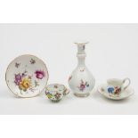 A late Meissen bottle vase/guglet and four similar items: the guglet with garlic neck and painted
