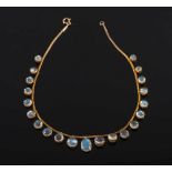 A moonstone fringe necklace: with circular moonstone graduated from 7mm diameter to 10.