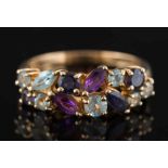 A modern 9ct gold and gem-set dress ring: mounted with marquise shaped amethysts and aquamarines,