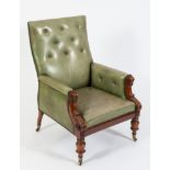 A Victorian carved mahogany and green leather upholstered library armchair:,