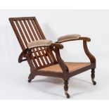 By James Shoolbread & Co - A 19th Century mahogany low adjustable armchair:,