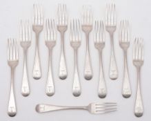 A set of twelve George III Scottish silver Old English pattern dessert forks,