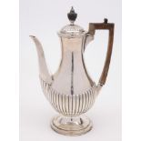 A late Victorian silver coffee pot, maker William Comyns & Son, London,