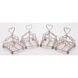 A set of four Edward VII silver four-division toast racks, maker Atkin Brothers, Sheffield, 1903:,