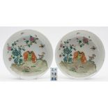 A pair of Chinese famille rose saucer dishes: each painted with a caparisoned elephant standing by
