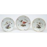 Three Meissen porcelain saucer dishes: each enamelled with two birds on a leafy branch amongst