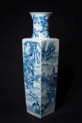 A large Chinese blue and white vase: of flared square section with waisted neck,